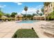 Resort-style pool area with lounge chairs, cabanas, and lush tropical landscaping at 504 Mirasol Cir # 102, Kissimmee, FL 34747