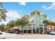 Corner building featuring a charming street view with architectural details and lush trees at 504 Mirasol Cir # 102, Kissimmee, FL 34747
