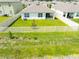 Aerial view of a backyard, complete with a white fence, showcasing a private and spacious outdoor area at 5934 Shingle Creek Rd, Lakeland, FL 33811