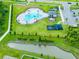 Aerial view of the pool and playground amenities, with ample parking, located in a well-maintained community at 5934 Shingle Creek Rd, Lakeland, FL 33811