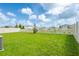 Expansive, fenced backyard offering ample space for outdoor activities and privacy at 5934 Shingle Creek Rd, Lakeland, FL 33811