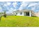 A spacious backyard with a lush green lawn and white vinyl fence surrounding the property at 5934 Shingle Creek Rd, Lakeland, FL 33811