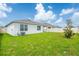 A large, well-maintained backyard is enclosed by a white fence, providing a secure outdoor space at 5934 Shingle Creek Rd, Lakeland, FL 33811