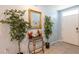 Bright hallway with tiled floors, decor and plants leading to the front door, and blue accent wall at 5934 Shingle Creek Rd, Lakeland, FL 33811