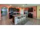 Spacious eat-in kitchen features granite countertops and stainless steel appliances at 5934 Shingle Creek Rd, Lakeland, FL 33811