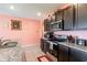 A full kitchen view with granite countertops and modern appliances at 5934 Shingle Creek Rd, Lakeland, FL 33811