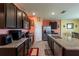 Modern kitchen features granite countertops, dark wood cabinets, and stainless steel appliances, offering both style and functionality at 5934 Shingle Creek Rd, Lakeland, FL 33811