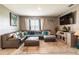 Cozy living room featuring a comfortable sectional sofa, and large screen TV at 5934 Shingle Creek Rd, Lakeland, FL 33811