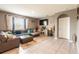 Comfortable living room with gray walls, large windows, and tile flooring at 5934 Shingle Creek Rd, Lakeland, FL 33811