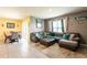 Open-concept living room with tile flooring and large windows at 5934 Shingle Creek Rd, Lakeland, FL 33811