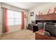 Functional office space with a built-in desk, ample storage, and natural light from the window at 5934 Shingle Creek Rd, Lakeland, FL 33811