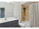 Bathroom featuring a combination shower and tub, a toilet, and a single sink vanity at 8628 Sw 133Rd Lane Rd, Ocala, FL 34473