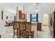 Bright and spacious kitchen featuring wooden cabinets, a bar with stools and an island at 8628 Sw 133Rd Lane Rd, Ocala, FL 34473