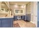 The large bathroom features cabinets with granite countertops at 12902 Sw 138Th Loop, Dunnellon, FL 34432