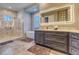 The bath has a shower and tub with modern cabinets at 12902 Sw 138Th Loop, Dunnellon, FL 34432
