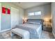 Calm bedroom with abundant light, comfortable bed, trendy furniture, and a charming high window at 12902 Sw 138Th Loop, Dunnellon, FL 34432