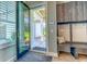 Welcoming entryway featuring a stylish bench, practical storage, and an inviting view of the outdoors at 12902 Sw 138Th Loop, Dunnellon, FL 34432