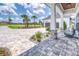 Inviting front porch featuring stone accents, stylish outdoor seating, and a beautifully landscaped entrance to the home at 12902 Sw 138Th Loop, Dunnellon, FL 34432