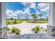 Expansive view of the home's landscaped front yard with meticulously designed paver driveway, leading to a grand entrance at 12902 Sw 138Th Loop, Dunnellon, FL 34432
