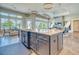 Spacious kitchen with a large island, modern fixtures, and a view into the dining and living areas at 12902 Sw 138Th Loop, Dunnellon, FL 34432