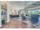 Bright, airy living room with a seamless flow to the kitchen and expansive outdoor views at 12902 Sw 138Th Loop, Dunnellon, FL 34432