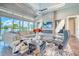 Elegant living room with comfortable seating, fireplace, and scenic backyard views at 12902 Sw 138Th Loop, Dunnellon, FL 34432