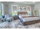 This main bedroom features two windows and contemporary décor at 12902 Sw 138Th Loop, Dunnellon, FL 34432