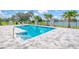 Beautiful pool with a paved deck, landscaping, and lake views at 12902 Sw 138Th Loop, Dunnellon, FL 34432