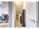 Storage space with water softener, cinderblock walls, and sealed floor, providing a clean look at 12902 Sw 138Th Loop, Dunnellon, FL 34432