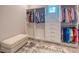 This walk-in closet includes clothing racks and built-in shelving at 12902 Sw 138Th Loop, Dunnellon, FL 34432