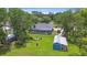 Large lot featuring a fenced pool, cozy fire pit, and convenient storage shed at 3229 Gardner Oaks Ln, Lakeland, FL 33810