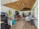 An open shed interior with a wood ceiling, light walls, and a seating area at 3229 Gardner Oaks Ln, Lakeland, FL 33810