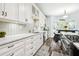Bright kitchen features white cabinets, sleek countertops, and modern appliances at 3229 Gardner Oaks Ln, Lakeland, FL 33810