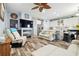 Open floorplan showing kitchen, living area, fireplace, and hardwood style floors at 3229 Gardner Oaks Ln, Lakeland, FL 33810