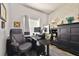 Home office with a large desk, comfortable chair, storage cabinet, and textured wallpaper at 3229 Gardner Oaks Ln, Lakeland, FL 33810