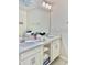 Bright bathroom with double vanity, ample storage, and clean, neutral finishes at 4751 Clock Tower Dr # 307, Kissimmee, FL 34746