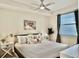 Cozy bedroom featuring natural light, modern furnishings, and a relaxing atmosphere at 4751 Clock Tower Dr # 307, Kissimmee, FL 34746