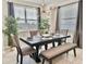 Elegant dining room with a contemporary light fixture and comfortable seating, perfect for entertaining at 4751 Clock Tower Dr # 307, Kissimmee, FL 34746