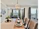 Bright, airy dining room featuring modern decor and seamless flow to an outdoor space at 4751 Clock Tower Dr # 307, Kissimmee, FL 34746