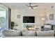 Relaxing living space with a large TV, comfortable seating, and a bright, airy feel at 4751 Clock Tower Dr # 307, Kissimmee, FL 34746