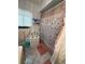 Bright bathroom featuring decorative towels, coastal accents, and a shower with themed curtain at 17569 Se 107Th Ct, Summerfield, FL 34491