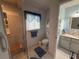 Bathroom with a glass-enclosed shower, bench, and blue accents, offering a refreshing and modern space at 17569 Se 107Th Ct, Summerfield, FL 34491