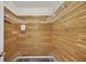 Walk-in closet with custom wooden walls and wire shelving, offering ample storage space at 17569 Se 107Th Ct, Summerfield, FL 34491