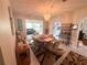 Inviting dining room featuring a chandelier, tile flooring and seamless transition to living areas at 17569 Se 107Th Ct, Summerfield, FL 34491