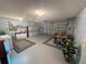 Spacious garage with ample storage, laundry area, and a dining table set up for entertaining at 17569 Se 107Th Ct, Summerfield, FL 34491