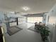 Well-lit garage featuring abundant storage, dining area, and convenient access to laundry facilities at 17569 Se 107Th Ct, Summerfield, FL 34491