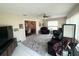 Inviting living room showcasing comfortable seating, tiled floors, and access to dining area at 17569 Se 107Th Ct, Summerfield, FL 34491