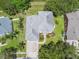 An aerial view showing the roof, landscaping, and driveway of a well-maintained home at 297 Beacon Pointe Dr, Ocoee, FL 34761