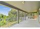 Expansive covered balcony overlooking lush greenery, perfect for relaxation and enjoying the outdoors at 297 Beacon Pointe Dr, Ocoee, FL 34761