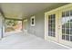 Spacious balcony with double doors offering easy access and scenic views of the surrounding neighborhood at 297 Beacon Pointe Dr, Ocoee, FL 34761
